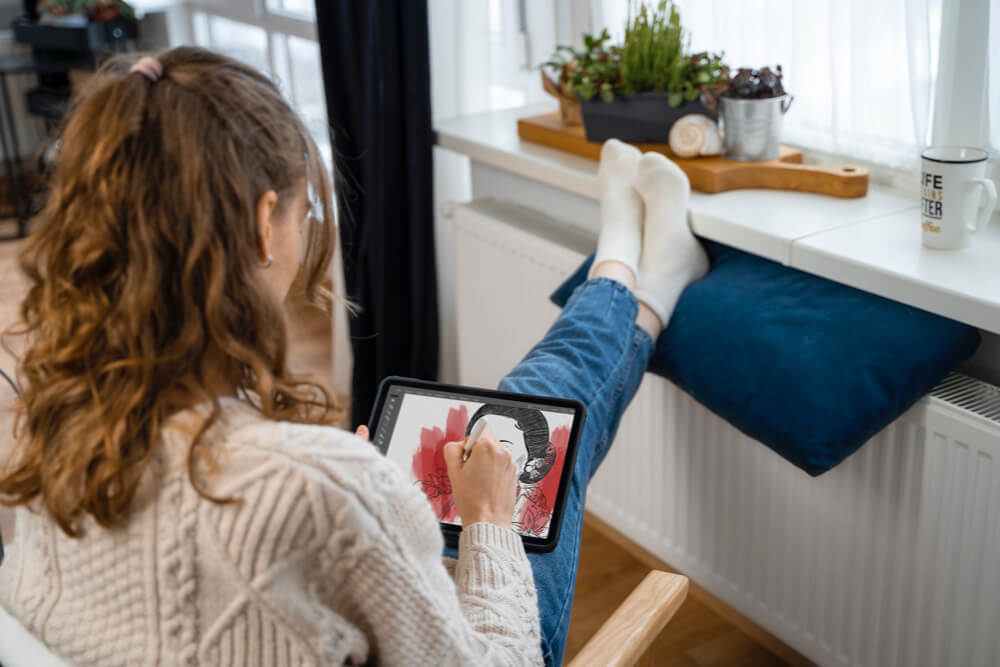 medium shot woman sitting near heater 2